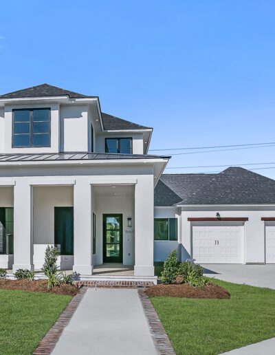 Modern two-story home with a double garage and landscaped front yard.